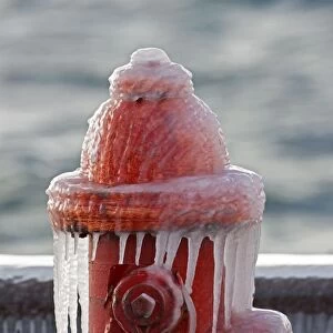 Ice - Red Fire Hydrant with Icicles Surrounded by Ice covered Grass - Near Seneca Lake in Upstate New York - USA