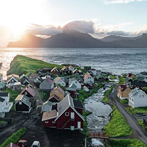 Aerial view of the coastal village of Gjogv and Kalsoy island at dawn, Eysturoy Island, Faroe Islands, Denmark, Europe