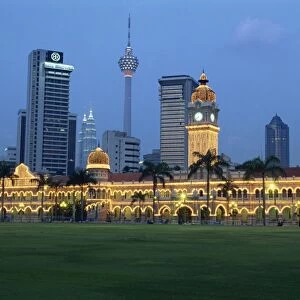 City skyline and the Sultan Abdul Samad Building illuminated at dusk