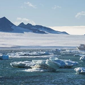 Cruise ship behind icebergs, Brown Bluff, Tabarin Peninsula, Antarctica, Polar Regions
