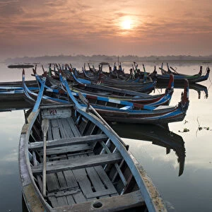 Fishing boats at sunrise on Lake Taungthaman near Amarapura, Myanmar (Burma), Asia