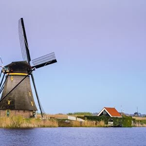 Historic Dutch windmills on the polders at sunset, Kinderdijk, UNESCO World Heritage Site