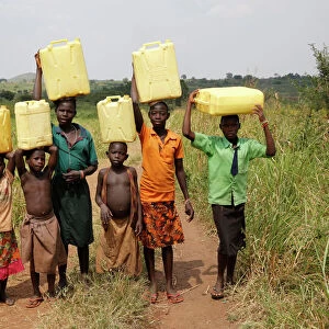 Ugandan children fetching water, Masindi, Uganda, Africa