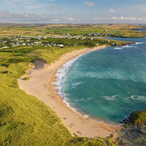 Aerial view of Constantine Bay in North Cornwall on a sunny summer evening, Cornwall, England. Summer (August) 2021