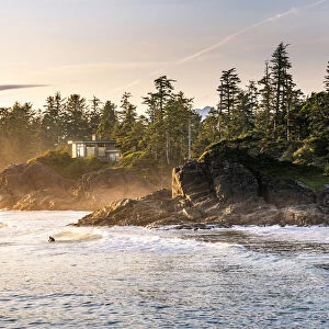 Cox Bay beach and surfers at sunset, Tofino, British Columbia, Vancouver Island, Canada