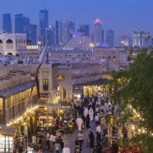 Qatar, Doha, Souq Waqif, redeveloped bazaar area, elevated view with West Bay skyscrapers