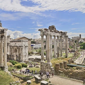 Italy, Rome, View of the Roman Forum from Capitoline Hill with ruins of the Arch of Septimus Severus and the Temple of Saturn prominent