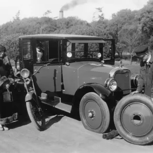 1925 Cleveland 6 having wheel changed after puncture 1925 Cleveland 6 having wheel changed after puncture