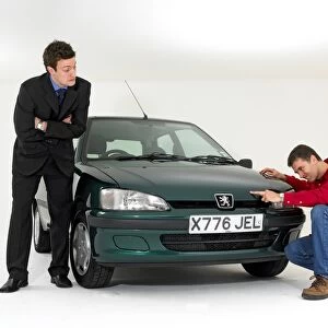 Car salesman helping customer
