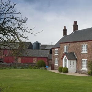 Red brick farmhouse, Cheshire, England, april