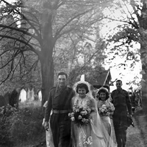 Bridal party walking from Kirdford Church, 1945
