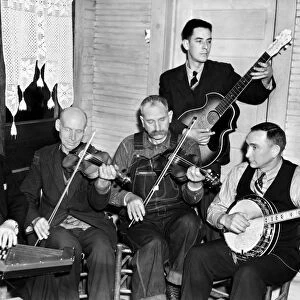 BOG TROTTERS BAND, 1937. Members of the Bog Trotters Band. Left to right: Doc Davis with autoharp