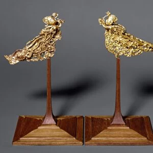 Gold headdress ornaments in the form of a pair of apsarases (angels of Buddhist mythology). T ang Dynasty, 618-907 A. D