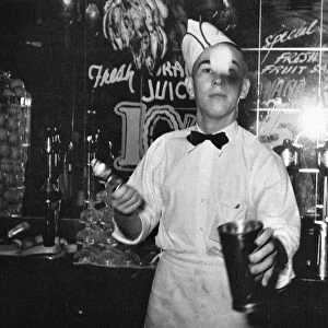 A soda jerk at a soda fountain in Corpus Christi, Texas. Photographed by Russell Lee in 1939