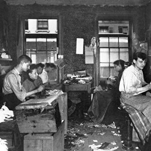 SWEATSHOP, 1890. A necktie workshop in a tenement on Division Street, New York City