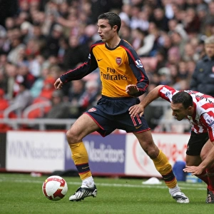 Robin van Persie (Arsenal) Steet Malbranque (Sunderland)