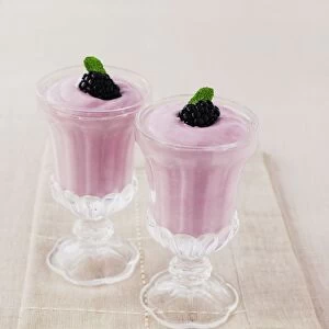 Glasses of blackberry fool, close-up