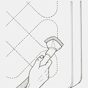 Black and white illustration of hand cleaning mattress with vacuum cleaner