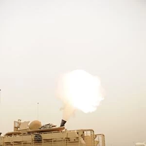 A M120 Mortar system is fired out of a M113 Armored Personal Carrier
