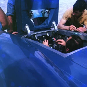 Donald Campbell in Bluebird CN7 cockpit at Lake Eyre 1963, Ken Norris on right. Creator: Unknown