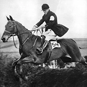 The Prince of Wales taking a fence in the bridge of Guards Challenge Cup race, c1930s