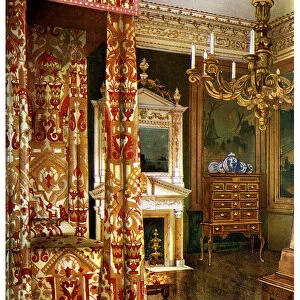 Queen Annes bed, chest of drawers upon a stand and a wooden candelabra, 1910. Artist: Edwin Foley