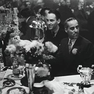 1938 Donington Grand Prix. Donington Park, Great Britain. 22nd October 1938. Tazio Nuvolari and Dick Seaman enjoy the celebrations at the after-race dinner party, portrait. World Copyright: LAT Photographic. Ref: L89 - 2