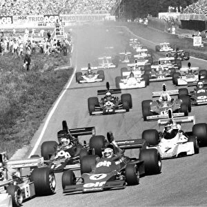 Anderstorp, Sweden. 6-8 June 1975: Vittorio Brambilla, March 751-Ford, retired, leads the field through the first corner followed by Patrick Depailler