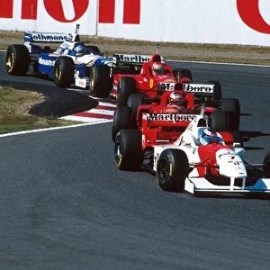Formula One World Championship: 3rd placed Mika Hakkinen Mclaren MP4-11 leads Schumacher, Irvine and Villeneuve