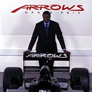 Formula One World Championship: Prince Malik Ado Ibrahim Investor in the Arrows team poses with the Arrows F1 car