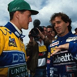 Formula One World Championship: World Champion Alain Prost, right, talks with Michael Schumacher