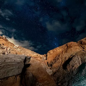 Stars in the night sky above a rocky ravine in the Atacama Desert, San Pedro De Atacama, Chile
