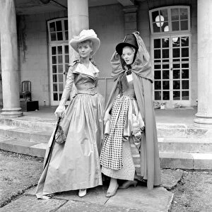 Actresses and models take part in a 18th century fashion parade at Pinewood Studios