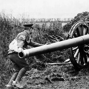 British gunners struggle to pull a 60 pounder field gun into position during World War