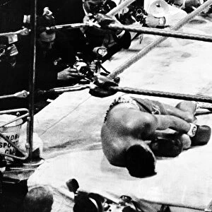 British Heavyweight Boxer Brian London lays on the canvas at Earls Court after being