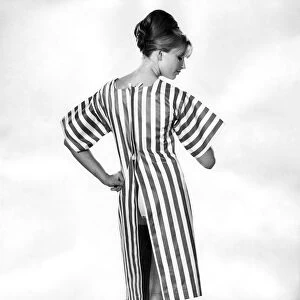Clothing Beach. Striped beach dress with open back. July 1964 P017997