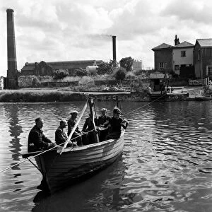 Ferry boy Keith Pollard operating the boat across the River Exe. June 1952 C3127