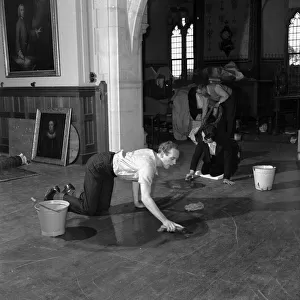 Lord Montagu seen here scrubbing away with a floor brush with an ardour that would excite