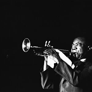 Louis Armstrong preforming on stage whilst on tour circa 1968