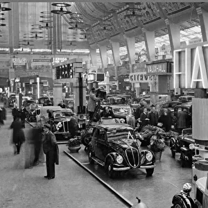 The Motor Show, 1935, at Olympia London. Centre is the Fiat stand
