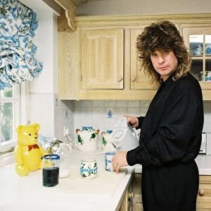 Ozzy Osbourne at home making a cup of tea. May 1988