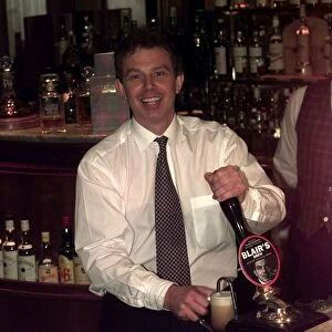 Tony Blair Labour Party leader in a pub pouring a half pint of beer that has been named