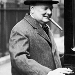 Winston Churchill pictured smoking a cigar, circa March 1938