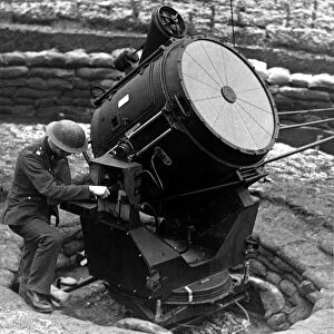 World War Two - Second World War - A searchlight is overhauled before nightfall at an