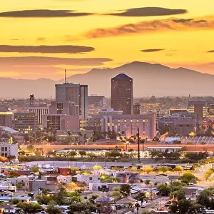 Tucson, Arizona, USA downtown city skyline with mountains at twilight