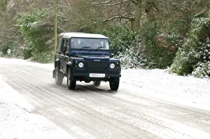 <b class=qtipBold><figcaption>2002 Land Rover</figcaption></b><br>2002 Land Rover Defender driving on snowy road, 2009 2002 Land Rover
