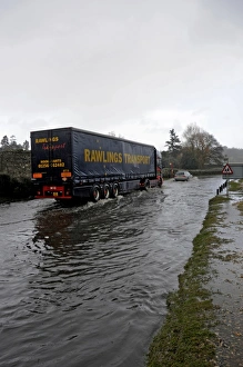Lorry driving on flooded road