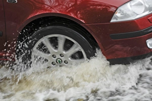 Car driving through flood