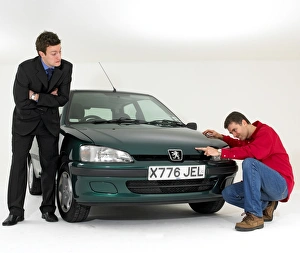 Car salesman with customer