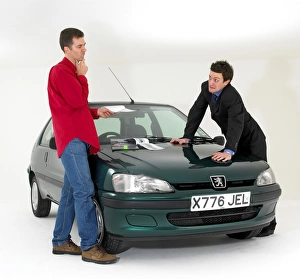 Car salesman with customer